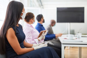 Business people with mask in meeting with video conference